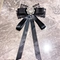 Pikkukuva 3 / 9: Rusetti pitsiset Bowknot-rintakorut C C C