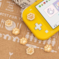 Miniatyrbilde 5 av 5: 4 stk. kattepoteformede tommelgrepshetter, mykt silikon joystickdeksel kompatibelt med Nintendo Switch/OLED/Switch Lite (brun og gul)