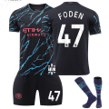 Miniatyrbilde 1 av 2: 2324 Manchester City 2 bortebarns fotballsett med sokker 47 FODEN children' sizes18
