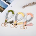 Miniatyrbillede 2 af 4: Silikone nøglering armbånd håndledsrem nøglering unik perlearmbånd nøgleringe med læderkvast Anti-lost nøglering (læder pink)