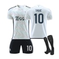 Miniatyrbild 1 av 2: Ajax bortaställ för barn 2023/24 med strumpor 10 TADIC XXL