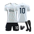 Miniatyrbillede 1 af 2: Ajax udebanebørnefodboldsæt med sokker og beskyttelsesudstyr 23/24 10 TADIC XL