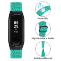 Pikkukuva 3 / 5: Joustava naarmuuntumaton säädettävä nylonranneke Xiaomi Mi Band 3/4 -älykellolle, mustalla kellokotelolla Mint Green