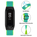 Pikkukuva 3 / 5: Joustava naarmuuntumaton säädettävä nylonranneke Xiaomi Mi Band 3/4 -älykellolle, mustalla kellokotelolla Yellow Green