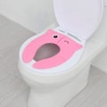 Pikkukuva 5 / 7: WC-istuimen koulutuskansi, matkustus-WC-istuimen kansi, taittuva
