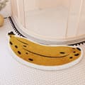 Badeværelsesmåtte i halvbueform med bananmønster til udenfor bruseniche - vandabsorberende