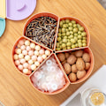 Miniatyrbilde 3 av 5: Godteri oppbevaringsboks Roterende kronbladformet snacksboks Godteriboks Snacks