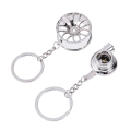 Miniatyrbillede 1 af 2: 2-i-1 Car Hub Turbolader Nøglering Holdbar Cool Zink Legering Mode Bil Nøglering Kreativ Gave Dekoration Pung Taske Pendant