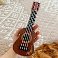 Miniatyrbild 2 av 4: Mini gitarr 4 strängar klassisk ukulele gitarr leksak musikinstrument för barn barn nybörjare tidig utbildning liten gitarr
