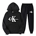 Miniatyrbilde 1 av 3: Todelt treningsdress for kvinner med lang ermet og kortere topp i svart Black 2XL
