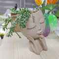 Miniatyrbild 6 av 10: Flickansikte Huvudstaty Docka blomkruka C C C