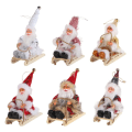 Miniatyrbillede 10 af 10: Siddende slæde julemands juledukkefigurer 3 3 3
