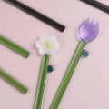 Miniatyrbild 6 av 10: Mjölkskedar i glas Blomstesked C C C