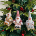 Miniatyrbillede 8 af 10: Siddende slæde julemands juledukkefigurer 3 3 3