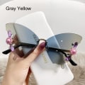 Pikkukuva 1 / 10: Crystal Butterfly Aurinkolasit Reunuksettomat aurinkolasit HARMAA KELTAINEN Gray Yellow
