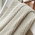 Pikkukuva 5 / 5: Pehmeä ja lämmin pohjoismainen neulottu peitto käsintehdyllä reunuksella - Beige (70 x 100cm)