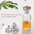 Miniatyrbillede 5 af 5: Små klare glasflasker med låg (60 ml) - Sæt af 12 med 3 rustfrie tragte