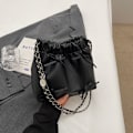 Miniatyrbild 7 av 8: 2024 Spring Style Bow Chain Väska Kvinnlig Partsu Axelpåse Kvinnlig Solid Färg Mjuk Läder Pleated Bucket Bag Ti Ti Det Silver
