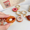 Miniatyrbillede 3 af 5: 3D Mode Sød Chokolade Donuts Dessert Silikone Cover Til Apple Airtag Etui Med Nøglering Holder Anti-tab Stødsikkert Beskyttelsescover Til Airt