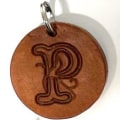 Miniatyrbillede 1 af 2: Handmade pendant of swedish leather with old english letter Nature P
