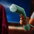 Miniatyrbild 5 av 6: Handhållen ångkokare - PHILIPS - STH5010/70 - 1300 W - Vertikal ångning - Kontinuerligt ångflöde - Sladd: 2,5 m - Grön
