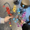 Miniatyrbilde 4 av 5: 4 Stykker Teleskopisk Sugkopp Robot Leke Deformasjon Teleskopisk Arm Ben Utdanningsleker Barn Voksne Tegneserie Utdanningsleker