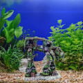 Miniatyrbillede 2 af 7: Dekorative ornamenter Kreativ akvarielandskabelig bil robot hund Transformers tema fisketank ornamenter harpiks håndværk 15.5 * 8.5 * 14cm 1 stk grøn