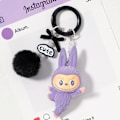 Pikkukuva 1 / 4: Söpö Mini Labubu Avaimenperä Sarjakuva Luova Kolmiulotteinen Nukke Opiskelijan Koululaukun Riipus Auton Avaimenperä Miehille ja Naisille Lahja ——MA Purple