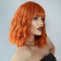Pikkukuva 3 / 5: Oranssi lyhyt kihara naisten peruukki