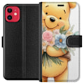 Miniatyrbillede 1 af 3: Apple iPhone 11 Tegnebogsetui Nalle Puh med blomster - klassisk børnefavorit i en blomstrende forårs miljø