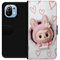 Pikkukuva 1 / 3: Xiaomi Mi 11 Lompakkokotelo Labubu Sydän Taustakuva Pop Mart Rakkausteema Hahmodesign Suosittu Motiivi Keräilytaideteossarja