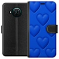 Pikkukuva 1 / 3: Nokia X10 Lompakkokotelo Siniset Sydämet