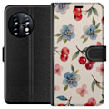Miniatyrbillede 1 af 3: OnePlus 11 Tegnebogsetui Bær & Blomster - mønster med blå b
