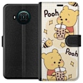 Pikkukuva 1 / 3: Nokia X10 Lompakkokotelo Nalle Pooh - klassinen karhumotiivi uudessa tulkinnassa