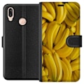 Miniatyrbild 1 av 3: Huawei P20 lite Plånboksfodral Banana Pattern – lekfullt mönster med gula bananer