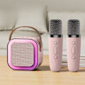 Miniatyrbilde 1 av 2: K12 Bluetooth-høyttaler med integrert mikrofon for utendørs live og hjemme-karaoke med 2 mikrofoner pink