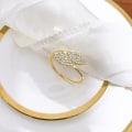 Miniatyrbillede 2 af 5: Servietring, 12 stk. runde servietringe og guld servietholder