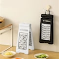 Miniatyrbilde 7 av 8: Mote Grater Grønnsakskutter Grønnsakslicer Allsidig Gadget Behandling Verktøy Grønnsakskutter for Fruktslicer Black