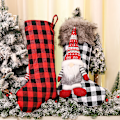 Miniatyrbild 3 av 5: Jultomtens strumpor i svenskt rött rutigt tyg