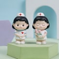 Miniatyrbillede 3 af 6: 2 sygeplejersker, engel i hvidt, frisk fødselsdagskage, bagt