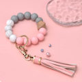 Miniatyrbillede 4 af 5: Silikonperle Armbånd Nøglering Håndledsrem Nøglering Bangle Kæder til Kvinder med Læder Kvast Pink
