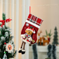 Miniatyrbillede 1 af 3: Jule-strømper bruges til at fylde og hænge julepynt. D
