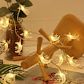 Miniatyrbillede 4 af 5: Silikon-fe-lys til julepynt Stjerne og måne, varme farver. Star and moon, warm colors. 10 m80lights 3 battery packsUSB