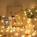 Miniatyrbilde 1 av 5: Silikon-fe-lys for julepynt Stjerne og måne, varme farger. Star and moon, warm colors. 10 m80lights 3 battery packsUSB