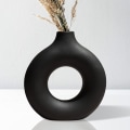 Miniatyrbillede 1 af 5: Sort Keramisk Vase Nordisk Cirkulær Mat Hul Donut Blomst