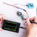 Miniatyrbild 2 av 5: DS213 Mini Digitalt Oscilloskop 100M Sa/S 15MHz Fickoscilloskop