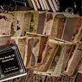Pikkukuva 3 / 5: Retro jäljityskirjan sivun materiaalipaperi vanhan kirjan sivun teksti Perhonen