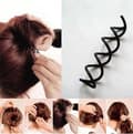 Spiralhårklämma: Stylar en volym i håret utan en elastisk hästsvans