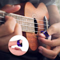 Miniatyrbilde 4 av 5: ULTNICE 15 stk Finger Raise Thumb Pick Set Plectrums med 15 Grid Case Oppbevaringsboks
