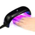 Mini neglelakstørrer med UV LED-lampe i sort